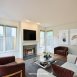 Awesome family room with fireplace & walls of windows! Awesome family room with fireplace & walls of windows!