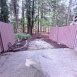 Private patio overlooks woods to rear